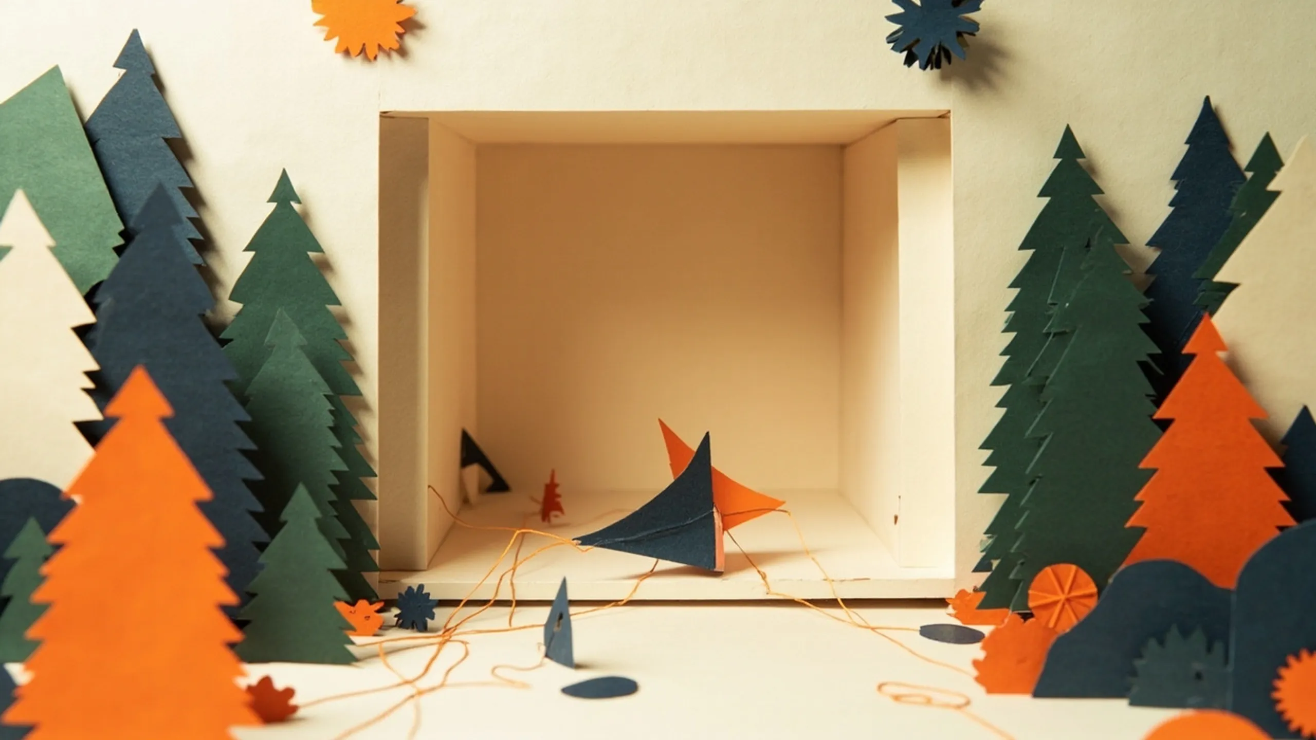 Paper-cutout illustration of an empty window frame like a puppet theater, with a paper cursor pulling levers connected to gears